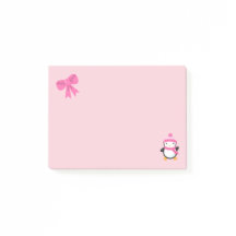 ピンクの帽子とスカーフとピンクの弓のかわいいペンギン