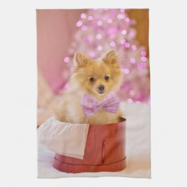 ピンクの弓のクリスマス写真を飾ったかわいい犬 キッチンタオル