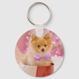 ピンクの弓のクリスマス写真を飾ったかわいい犬 キーホルダー