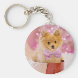 ピンクの弓のクリスマス写真を飾ったかわいい犬 キーホルダー