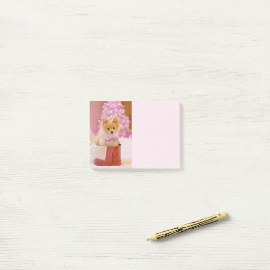 ピンクの弓のクリスマス写真を飾ったかわいい犬 ポストイット (デスク上)