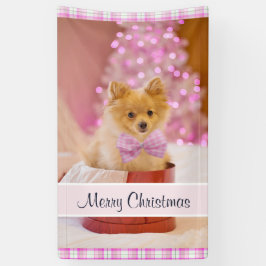 ピンクの弓のクリスマス写真を飾ったかわいい犬 横断幕