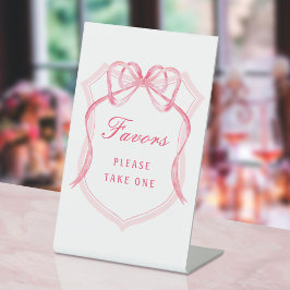 ピンクの弓のクレストはペデスタルサインを引き立てる 台座サイン