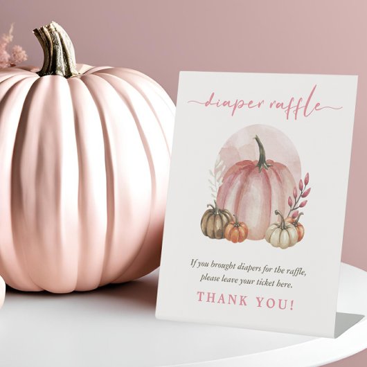 ピンクの甘いカボチャ赤ちゃん女の子シャワーおむつラッフル 台座サイン