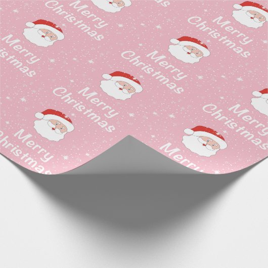 ピンクの背景にサンタと雪の結晶クリスマス ラッピングペーパー (角)
