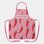 ピンクの背景にスパイシーな赤い唐辛子パターン エプロン (正面)