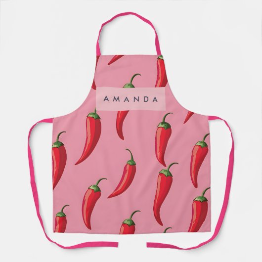 ピンクの背景にスパイシーな赤い唐辛子パターン エプロン (正面)