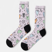 ピンクの背景にハートのらくがきとテキスト ソックス (左)