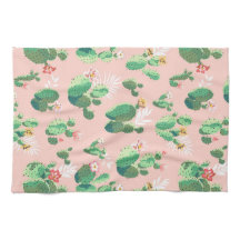 ピンクの背景の台所の花盛りのサボテン