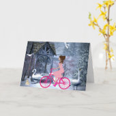 ピンクの自転車に乗ったかわいい女の子 冬 カード (黄色い花)