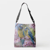 ピンクの花の木に青と黄色の芽が咲いている クロスボディバッグ (裏面)