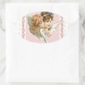 ピンクの開花した背景の天使 楕円形シール (バッグ)