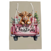 ピンクハイランドカウのクリスマスガーリーフラッフィーなトラックの中の牛 ミディアムペーパーバッグ (正面)