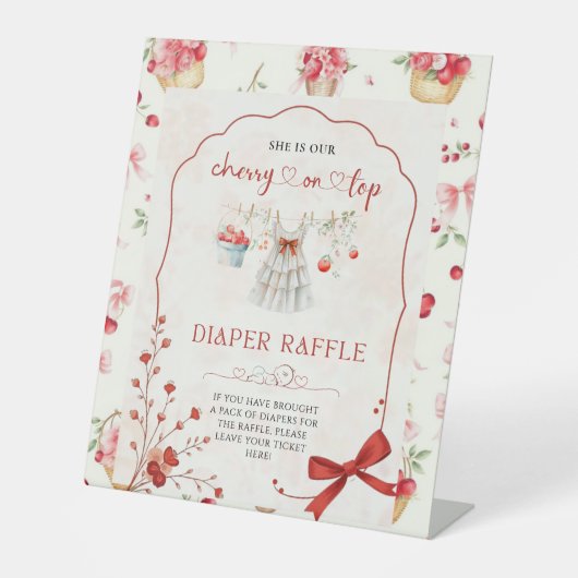 ピンクボウさくらんぼオントップおむつラッフル 台座サイン (正面)