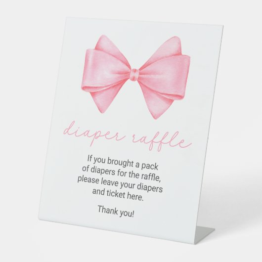 ピンクボウ赤ちゃんシャワーおむつラッフル 台座サイン (正面)