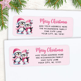 ピンクメリークリスマスキュートアイススケートで滑るペンギン ラベル