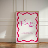 ピンク縁どの波型バーが花束を引き立てる 台座サイン