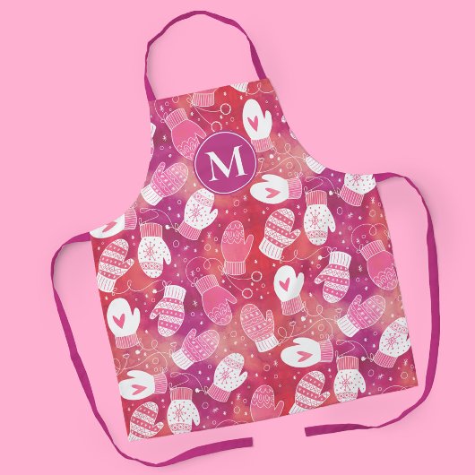 ピンク色の冬のクリスマスのミッテンス エプロン