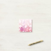 ピンク色の冬のクリスマスのミッテンス ポストイット (デスク上)