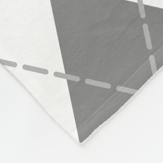 ピンク色の灰色の白いアーガイルプライモノグラムのド フリースブランケット (角)