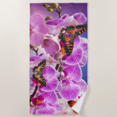 ピンク色の紫の蝶の蘭の花の水色 ビーチタオル (正面)
