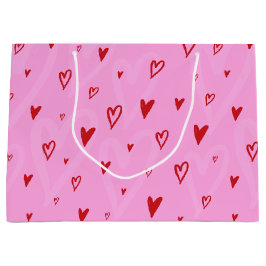 ピンク色の背景に可愛い赤いハート ラージペーパーバッグ