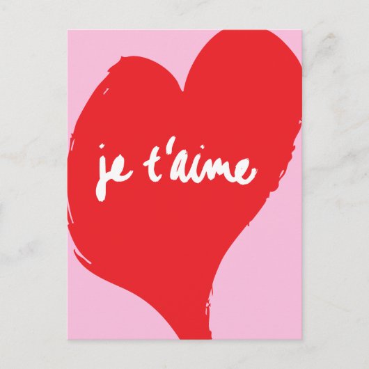 ピンク色の背景にje'aime-文字を持つ赤いハート ポストカード (正面)