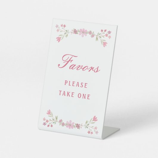 ピンク色の花が台座の看板を引く 台座サイン (正面)