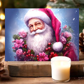 ピンク色の花のクリスマスを持つサンタ シーズンカード