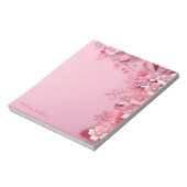ピンク色の花を背景に飾る ノートパッド (回転)