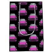 ピンク電気自動車SUV車の黒の背景 ミディアムペーパーバッグ (裏面)