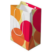 ピンク、オレンジ、黄色の水玉模様 ミディアムペーパーバッグ (正面アングル)