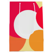 ピンク、オレンジ、黄色の水玉模様 ミディアムペーパーバッグ (裏面)