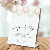 ピンク&ブルーバルーンジェンダーおむつラッフルを明らかにする 台座サイン