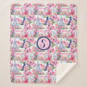 ピンク&ブルーパリモノグラパターン(の模様が)あるム シェルパブランケット (正面)