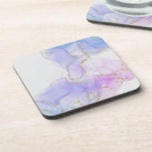 ピンク、紫、青のアルコールインク コースター (左側)