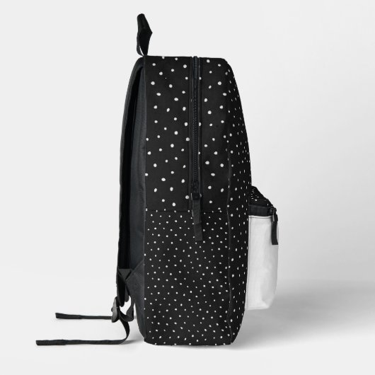 ピンドットにデイジーを付けたスティックスフィギュア プリントバックパック (左)