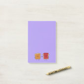 ピーナッツバターおよびゼリーの握りこぶしは友人のトーストをぶつけます ポストイット (デスク上)