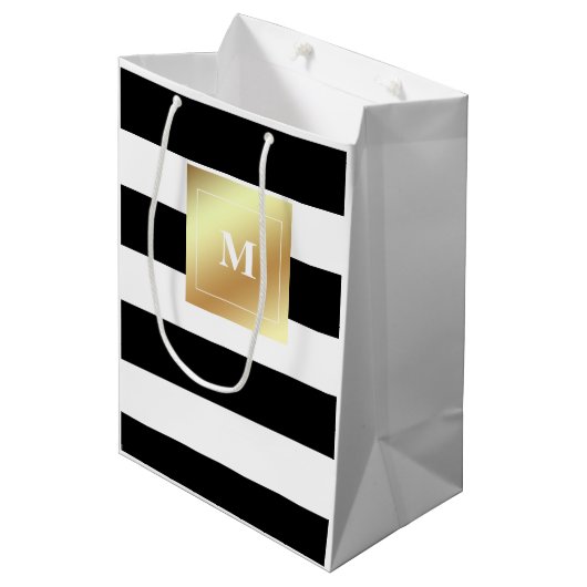 フェイクな金ゴールドのモノグラムが付いている白黒ストライプ ミディアムペーパーバッグ (正面アングル)