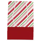 フェスティバルのパグでレッドサンタハットとクリスマスライト ミディアムペーパーバッグ (裏面)