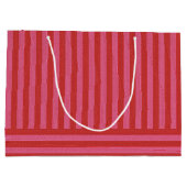 フェスティバルストライプピンクと赤おもしろいクリスマス ラージペーパーバッグ (裏面)