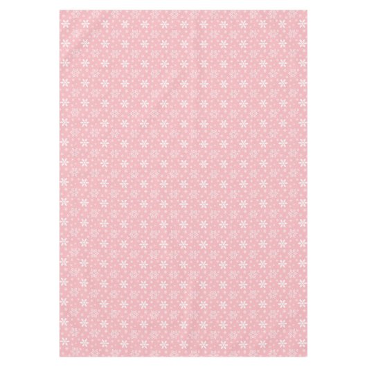 フェスティバルピンクの白い雪片タイルのクリスマス テーブルクロス (正面)