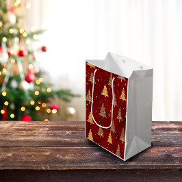 フェスティバル金ゴールドクリスマスツリーオンレッド ミディアムペーパーバッグ