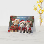 フェスティブな帽子をかぶったもふもふの友達 かわいい猫たち カード (黄色い花)