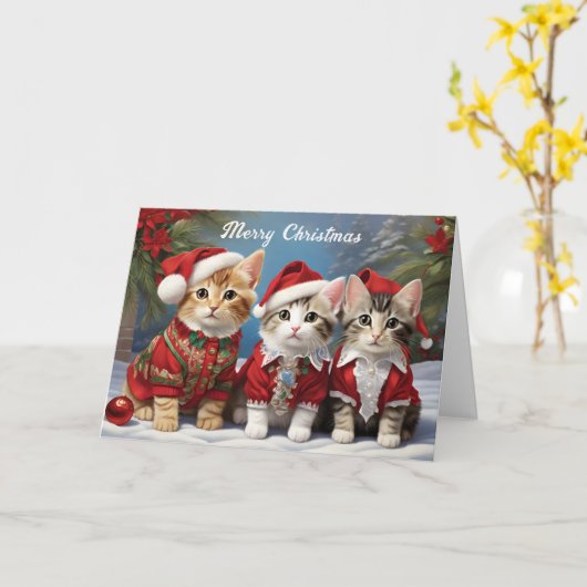 フェスティブな帽子をかぶったもふもふの友達 かわいい猫たち カード (黄色い花)