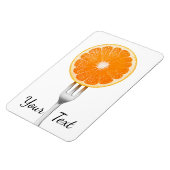 フォークにオレンジ マグネット (左側)