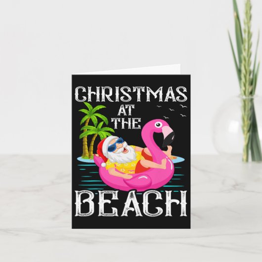 フラミンゴの浮き輪に乗ったサンタクロース ビーチのクリスマス カード (正面)