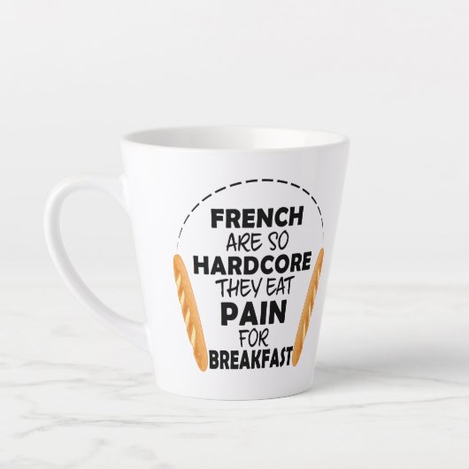 フランスの人食べのパンの痛みおもしろい カフェラテマグ (左)