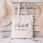 ブライドメイモダンドのミニマリストバチェロレッテ トートバッグ<br><div class="desc">私たちの"Bridesmaid Minimalist Script"コレクションでモダンあなたのバチェロレッテを高める。この絶妙な製品ラインはエレガンスコンテンポラリーと時代を超えたスタイルを体現し祝て、洗練された方法で新しい新しい世代にモダン最適である。私たちのミニマルなスクリプトデザインは、あなたの花嫁を最前線に置き、すべての要素にクラスのtouchを追加する。バチェロレッテ招待状、シックなカスタム飲み物用品、アクセサリーなどスタイリッシュに、お祝いを忘れられないアイテムの厳選された選択を提供する。各製品はミニマリズムの本質を反映するように細心の注意を払って作られモダン、クリーンなラインと洗練を醸し出す控えめな美意識を持つ。これらのアイテムをパーソナライズする機能を使用して、あなたの好みに合わせてユニークあなたのバチェロレッテを本当に作ることができる。お友達やブライダルパーティと一緒に永遠の思い出を作り出し、私たちモダンの「ブリデスメイド結婚ミニマリストスタイリッシュ」コレクションでとお祝いのトーンを設定モダン。あなたの花嫁に感謝を示し、あなたのバチェロレッテ経験を高める完璧な方法である。</div>