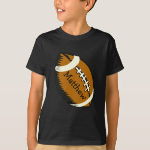 ブラウンのフットボールは子供のワイシャツを遊ばします Tシャツ